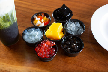 A view of a variety of popular milk tea toppings and ingredients.