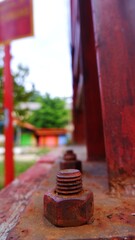 close up rusty screw nuts and bolts on suspension bridge. close up photo. selective focus photo 
