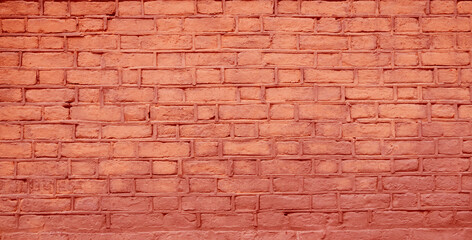 Rustic brick wall texture background. Rich red tones.