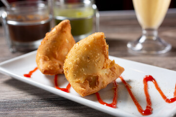 A view of a plate of samosas.
