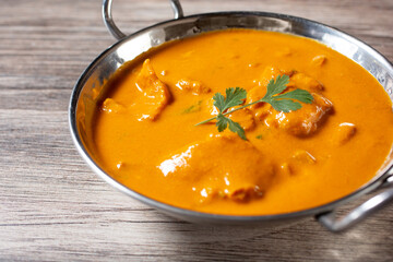 A view of fish curry, in a karahi bowl.