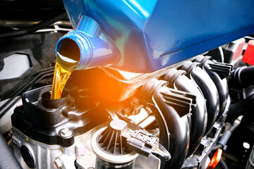 Refueling and pouring oil quality into the engine motor car Transmission and Maintenance Gear .Energy fuel concept.