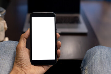 business man hand using smartphone with Screen blank with clipping path In the coffee shop