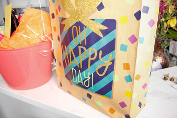 A view of a birthday gift bag that says Oh Happy Day.