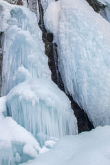 Frozen waterfall in the Zailiyskiy Alatau mountains in central asia on a frosty winter day