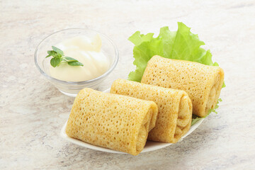 Stuffed pancakes with meat and cream