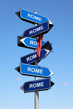 Naklejki Street sign with Rome city name on blue sky background. All roads lead to Rome quote