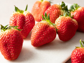 fresh strawberries on a white plate
