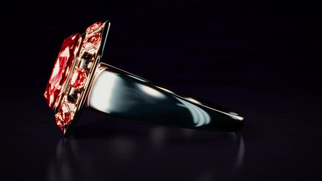Dark metal ring with red ruby jewel rotates, isolated, fictitious - loop video