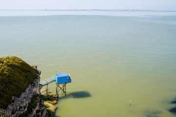 fish net pontoon wooden hut cabin blue for fisherman in Saint-Palais sea gironde estuary France