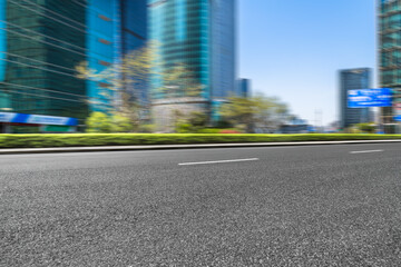 empty asphalt road with shanghai city skyline background in china
