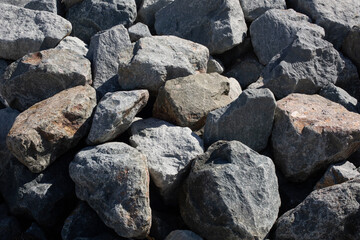 Large rocks in the pile on the beach