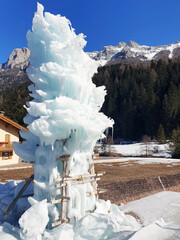 Tall snow sculpture. Vertical photo.