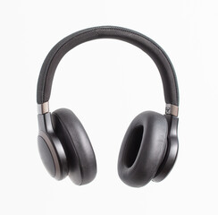 Black audio headphones isolated on white background.