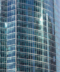 Obraz premium Glass walls of a skyscraper as a background.