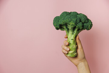 broccoli in hand - obrazy, fototapety, plakaty