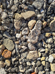 photo of building stones, rubble in sunlight of different shapes like cement and brick background for the whole format close-up