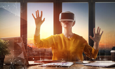 Woman with VR virtual reality goggles