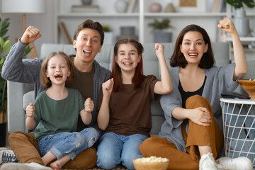 Mother, father and daughters spending time together.