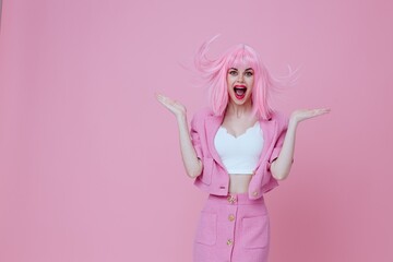 Beautiful fashionable girl bright makeup pink hair glamor pink background unaltered