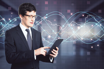 Stats concept with businessman using digital tablet on virtual screen squared background with glowing data spiral lines, dots and graphs