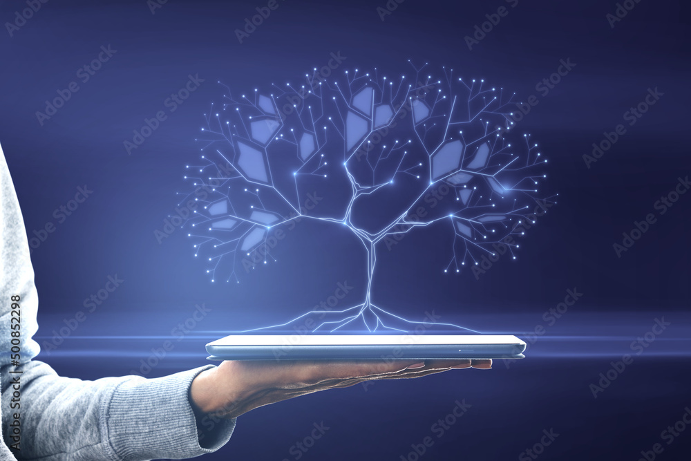Poster close up of female hand holding tablet with abstract digital tree on blurry background. big data and