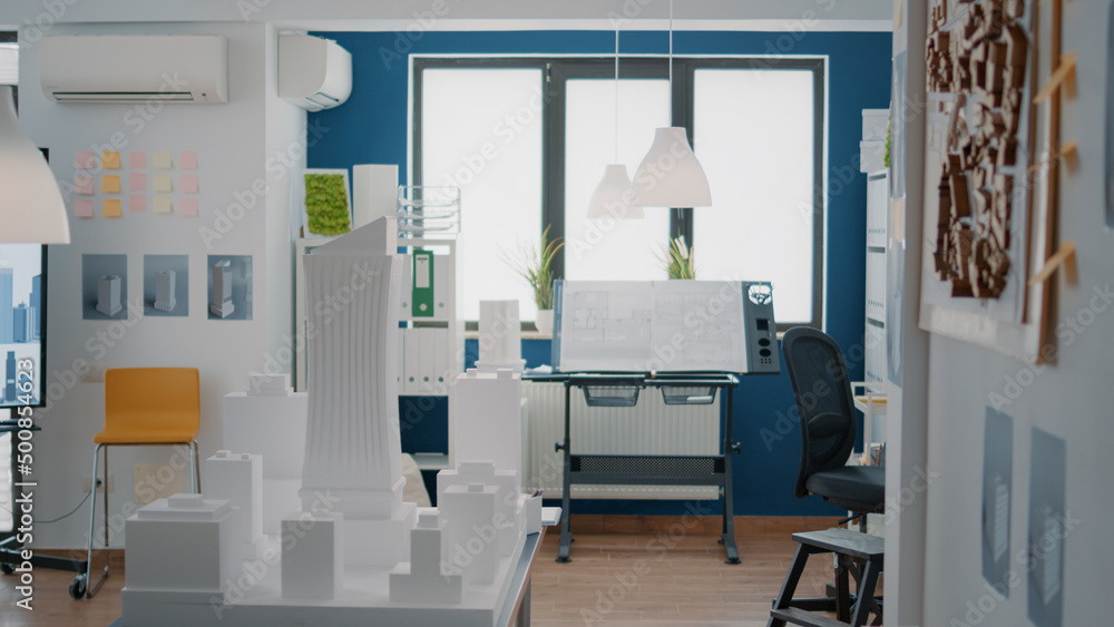 Poster nobody in office with blueprints plans to design building model for architecture project. empty spac