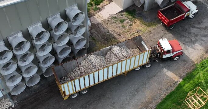 Trailer full of dead chickens killed by Avian Flu in USA. Aerial of bird influenza euthanized flock.