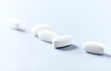 Lysine tablets. Concept for a healthy dietary supplementation. Nervous System Support. Soft focus. Bright background. Close up. Copy space.	