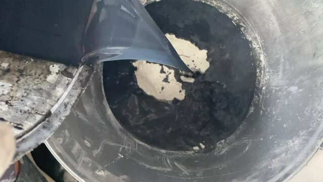 The process of combining the ingredients of the building mixture