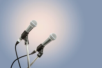 Obraz premium two microphone blue background