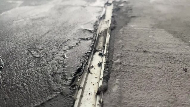 Applying a decorative microcement coating to the floor