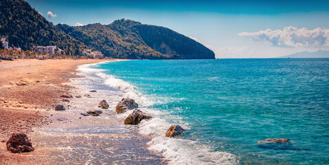 Panoramic summer view of publik beach in Dhermi town. Picturesque morning seascape of Adriatic sea. Beautiful outdoor scene of Albania, Europe. Vacation concept background..