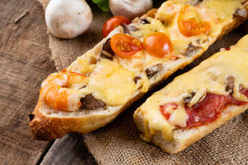 Homemade pizza sandwich, italian shrimp and cheese sandwich close-up.