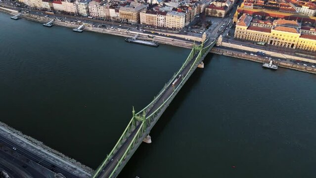 Tram passing across Liberty bridge in Budapest Hungary with Danube river view ,4K aerial topdown drone shot 2