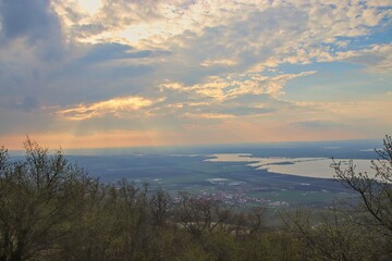 A view to the landscape with fields and lake from the Palava hills during sunset near Pavlov, Czech republic