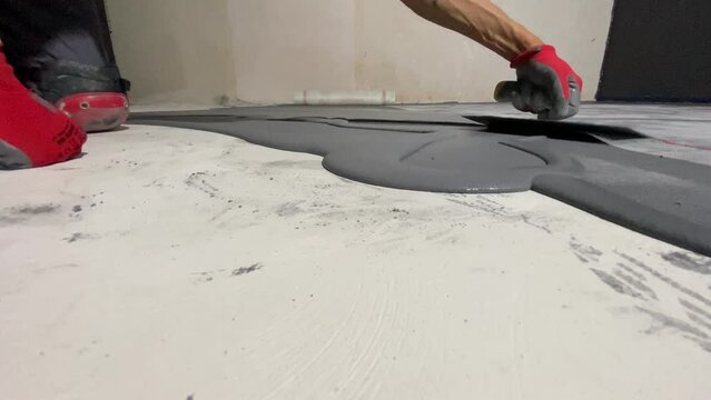 Applying a decorative microcement coating to the floor