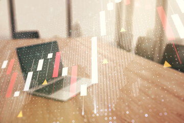 Multi exposure of abstract creative financial graph with world map on modern laptop background, forex and investment concept