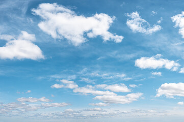 some white whispy clouds and blue sky cloudscape. Beautiful clouds during summer time in Sunny day. Blue sky and white fluffy clouds