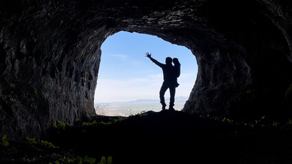 successful father and his child; a beautiful memory in the mountain cave