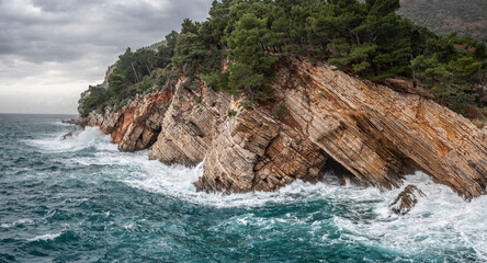 Rocky coast of the Adriatic Sea. Picturesque winter view to Adriatic sea coast near Petrovac, Montenegro. Adriatic coast landscape © Celt Studio