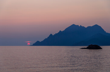 Naklejka na ściany i meble sunset on the coast of Corsica, France
