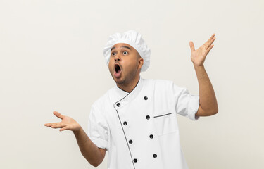 Wow excited face Young handsome asian man chef in uniform standing posting looking at blank space...