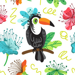 Fototapeta premium Toucan on the background of exotic flowers and leaves