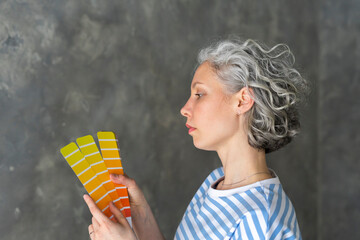 Woman with color swatch at new home