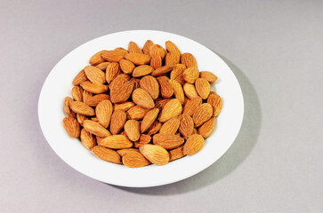 a bunch of almonds on a white plate