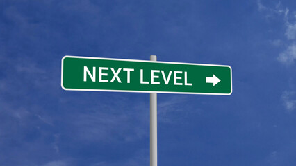 Next Level Road Sign on Clear Blue Sky with Rapid Moving Clouds