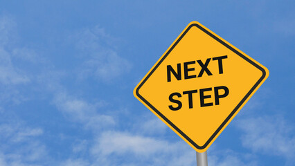 Next Step Road Sign on Clear Blue Sky with Rapid Moving Clouds for Text Placement