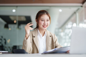 Data analysis, roadmap, marketing, accounting, auditing. Portrait of Asian businesswoman using...