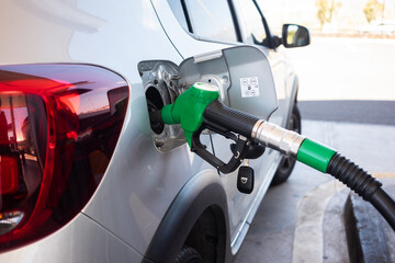Filling fuel into the car tank at the pump service station, for concept transportation power...
